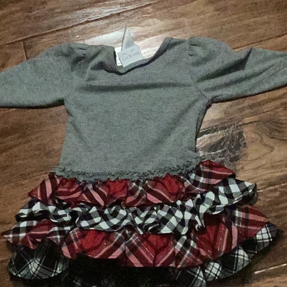 it’s a checker dress with red white and gray - Picture 2 of 2
